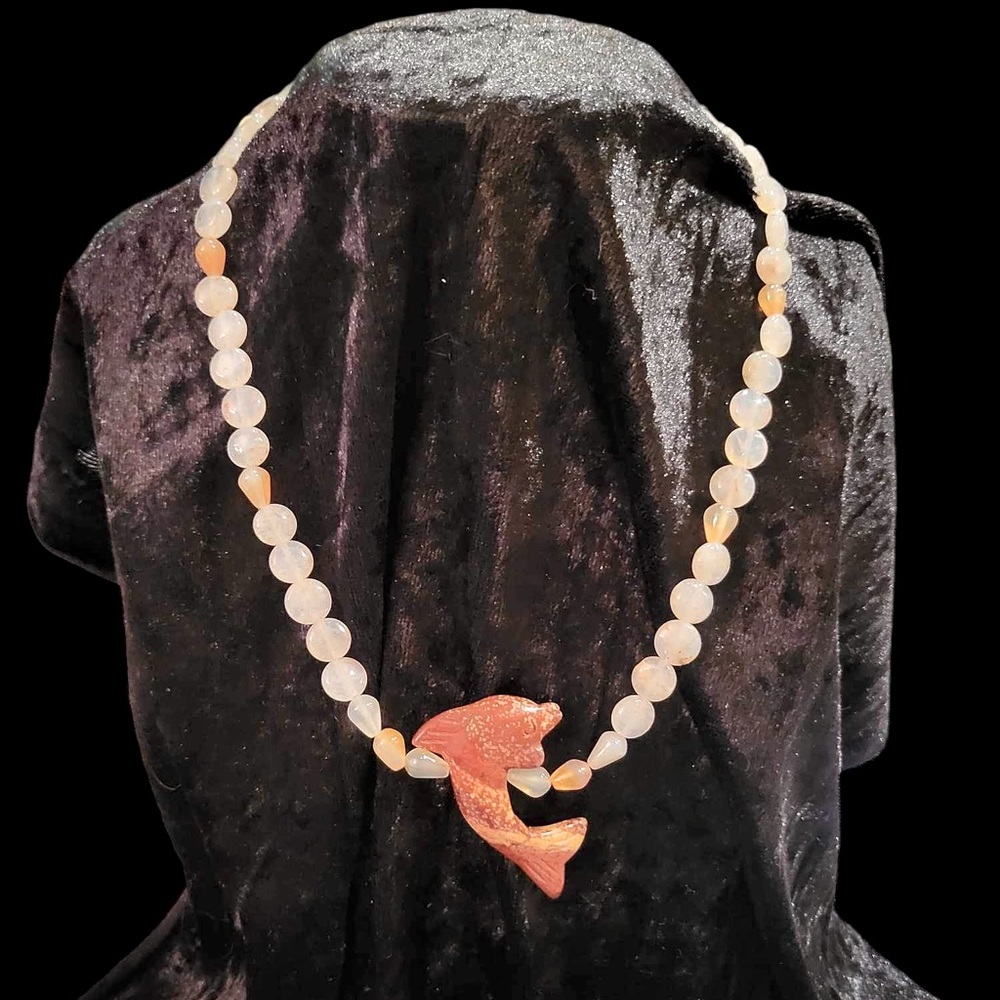 Stone dolphin necklace.